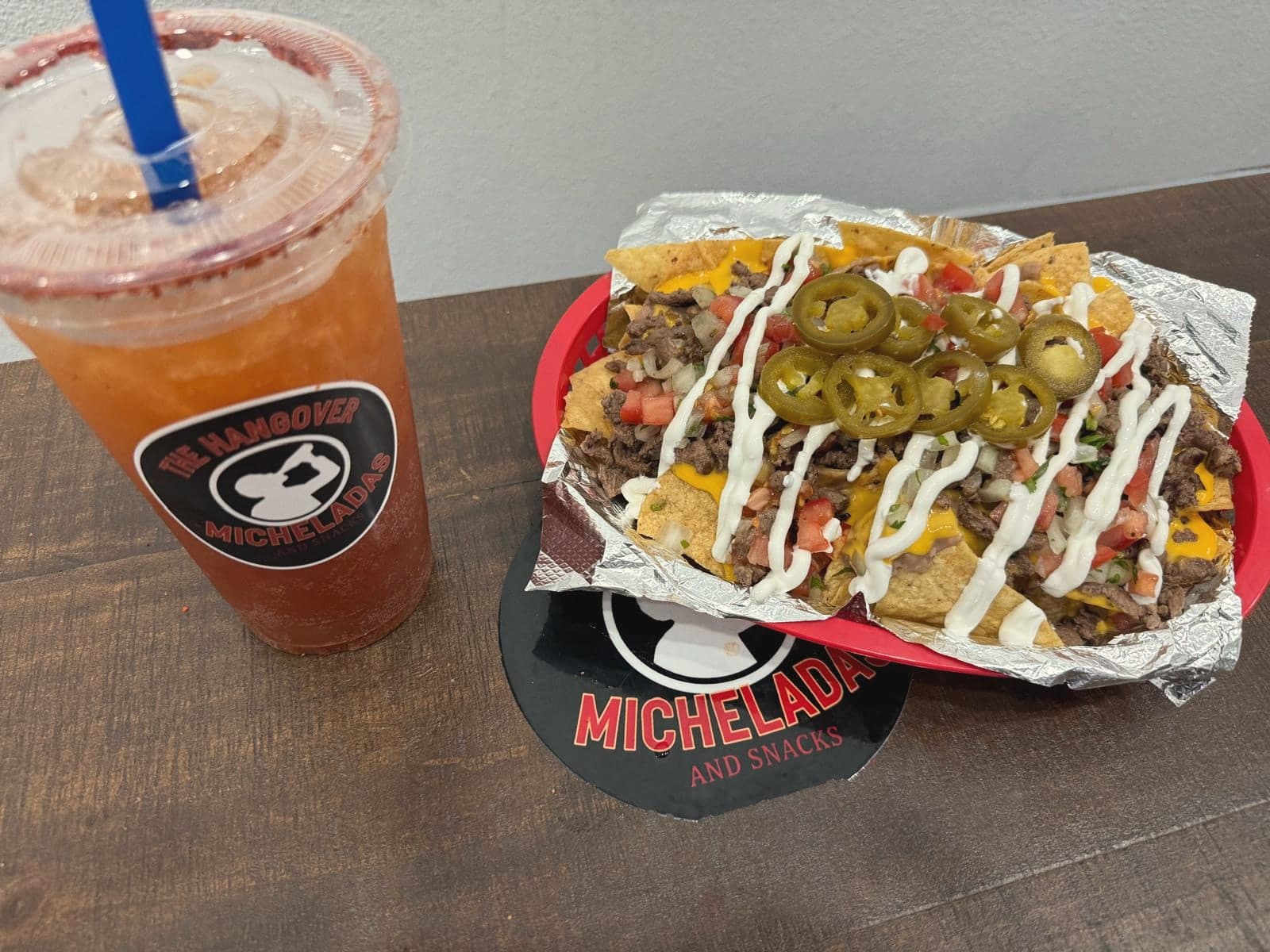 Loaded asada nachos with jalapeños